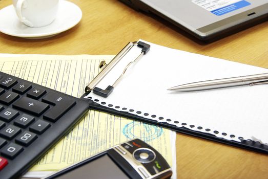Close-up of note paper and calculate 