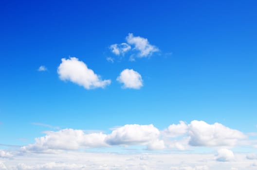 blue sky background with tiny clouds