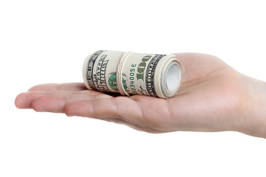 Human hand holding rolled up paper dollar currency