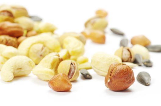 Assorted mixed nuts on white background