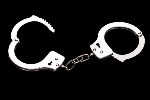 Crime law arrest police steel handcuffs isolated