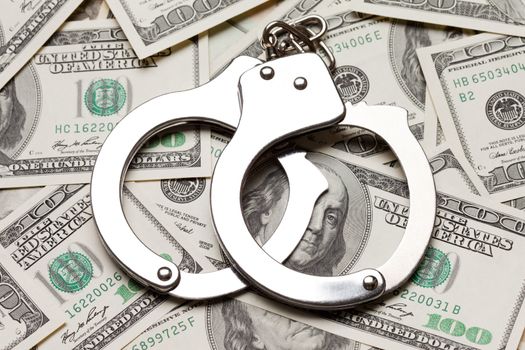 Crime law handcuffs arrests paper dollars currency