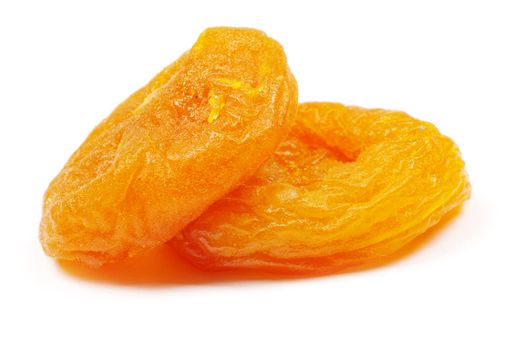 heap of dried apricots over white