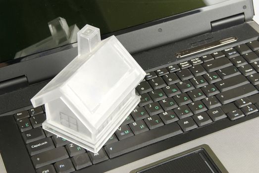 house isolated on laptop keyboard