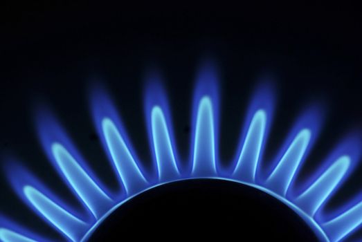flames of gas stove in the dark