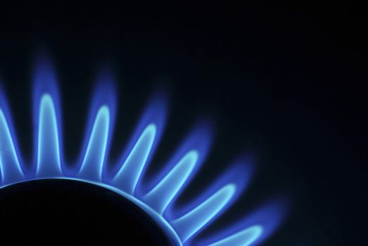 flames of gas stove in the dark