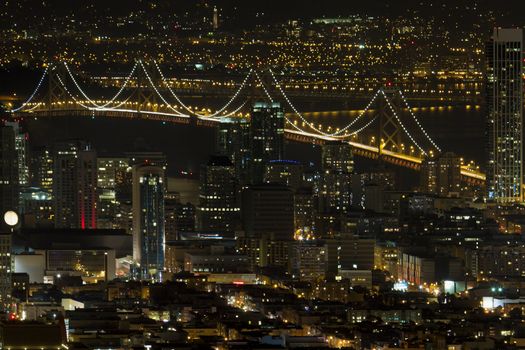 San Francisco California Cityscape with Oakland Bay Bridge Lit at Night