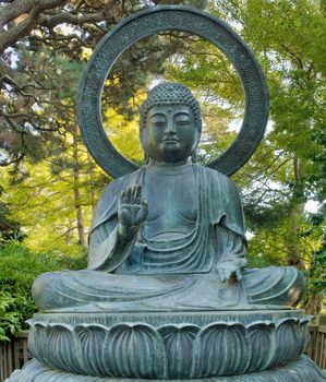 Sitting Bronze Buddha at San Francisco Japanese Garden in Golden Gate Park California