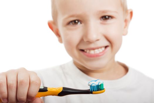 Little child with dental toothbrush brushing teeth