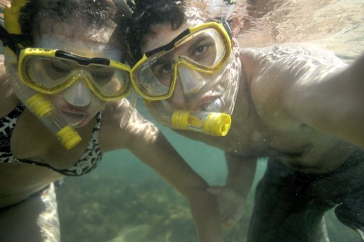 Scuba diving with underwater view.