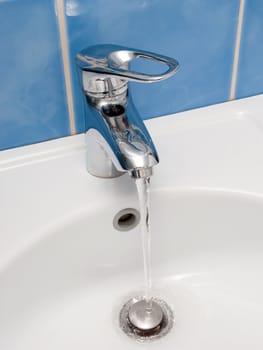 Clean sink and faucet at home toilet or bathroom