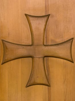 Old wood church door with religion cross