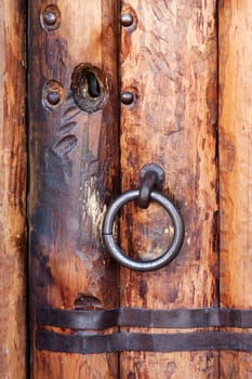 Old church closed entrance with wood door and lock