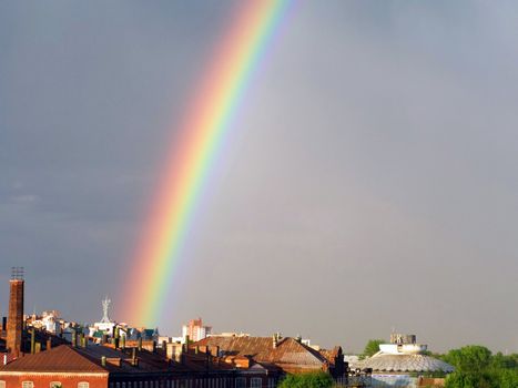 Rainbow multi color image on blue sky rain nature