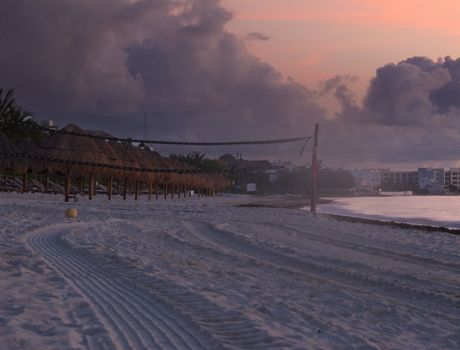 View of a beach volleyball field at sunrise