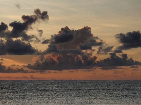 View of a sunrise, on a cloudy day, over the atlantic ocean