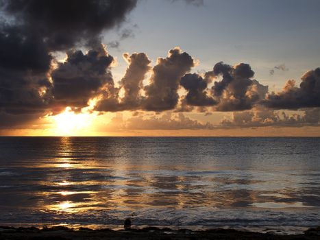 View of a sunrise, on a cloudy day, over the atlantic ocean