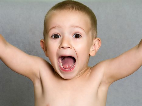 Little child boy shouting or screaming for fun