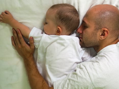 Sleeping father and cute child in family love life