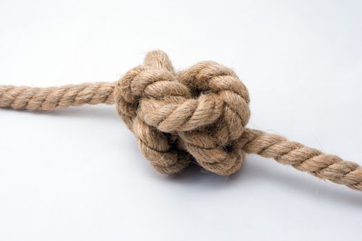 Tied up rope knot isolated on white background