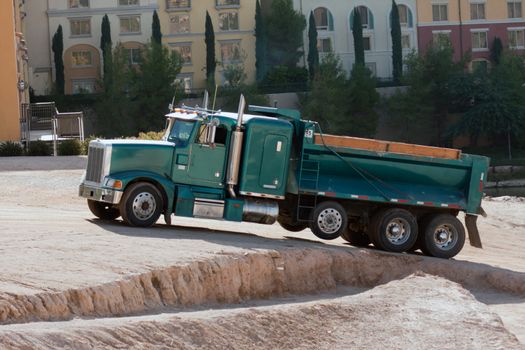 sand gravel truck hauling load from lake