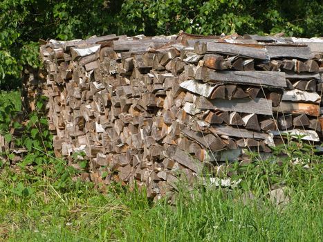 Stack of wood log or heap of lumber firewood