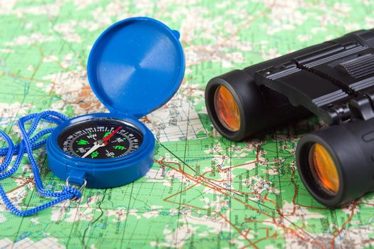 Travel north map direction compass and binoculars