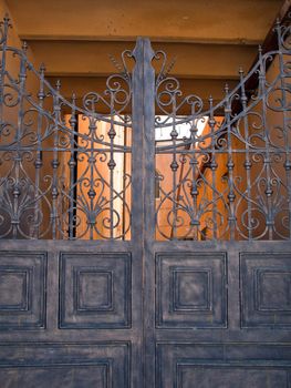 Old metal gate and security closed entrance door