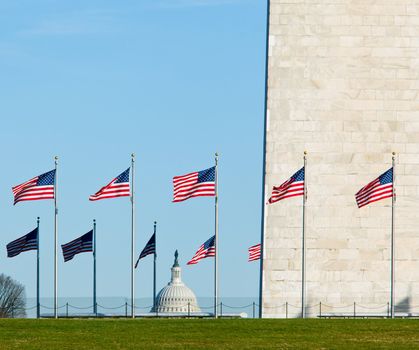 Washington Monument in DC on a clear winter day with Capitol dome in the distance
