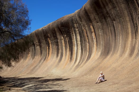 Mature woman at Wave Rock, near Hyden in Western Australia.