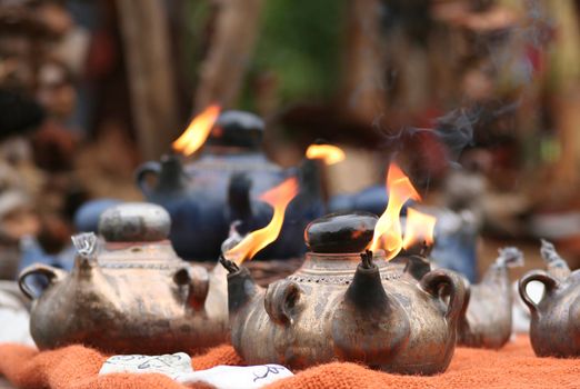 Arabic Oil Lamp with flames coming out of the pipes.