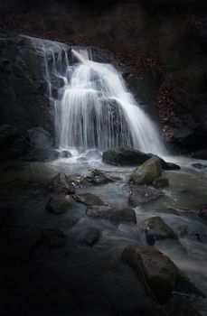 Mysterious Waterfall with dark background.