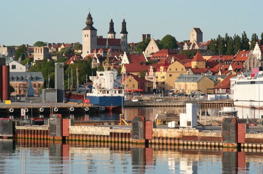 Busy town harbour with a mix of old and new.