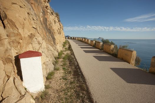 Old milestone on a scenic road above the Mediterranean