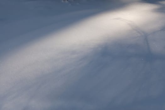 Image of snowbound field with light beam