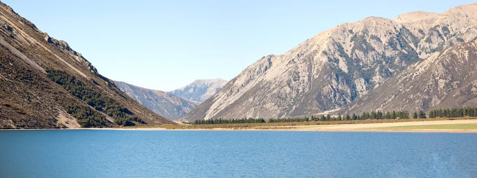 Panorama Landscape of mountain range at Lake Pearson Arthur's pass National Park New Zealand