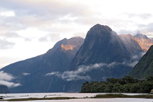 Sun rise high mountain glacier at milford sound, New Zealand