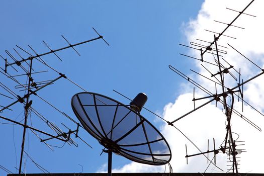 concpetual of satellite and antenna on blue sky