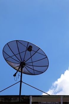 isolated of black satellite with sunny sky, vertical