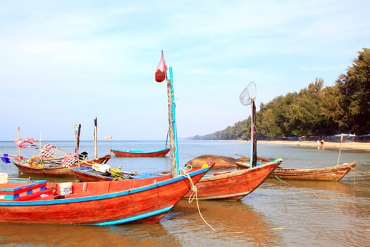 closeup of fisherman long tail boat on the beach