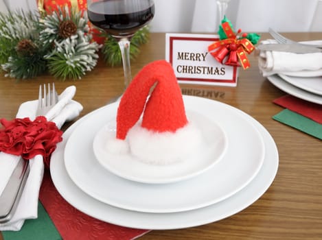 Christmas hat on a plate on a festive table