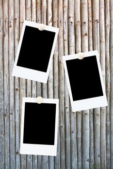 blank polaroids frames on a bamboo background