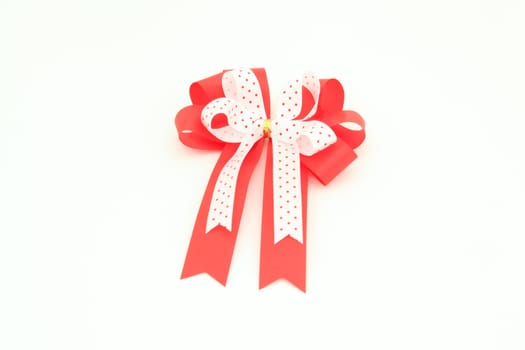 isolated red and white bow for holiday gift box over white