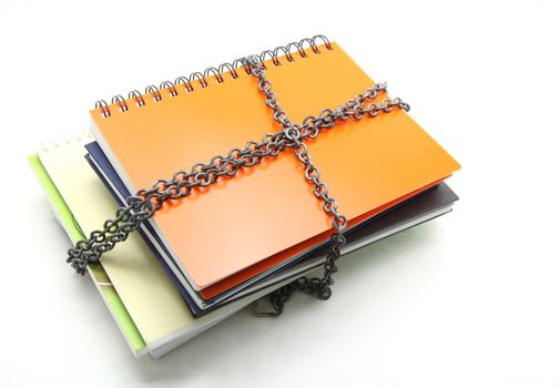 stack of books with chain