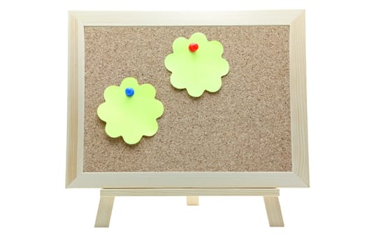 two flower shape memo paper on cork board on white background