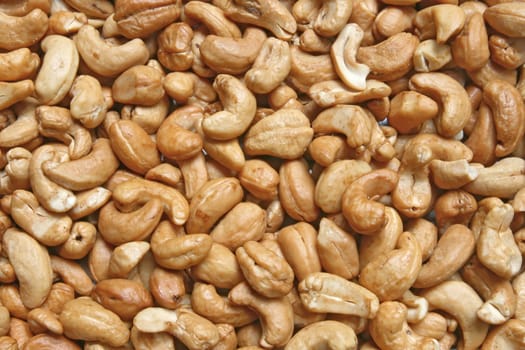 Closeup of Roasted Cashew with salt using as background