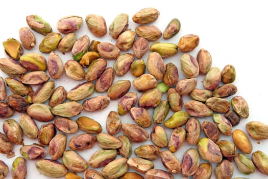 heap of roasted Pistachio isolated on white