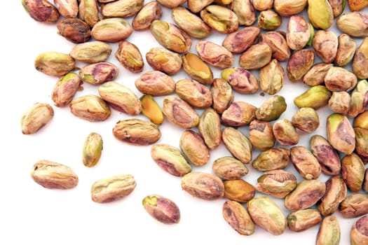 heap of roasted Pistachio isolated on white