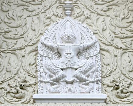 Traditional Thai Chinese Stone Carving in Flower Field and Garuda Bird shape