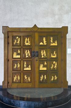 Thai Traditional Golden Carving on Wooden Door on Temple